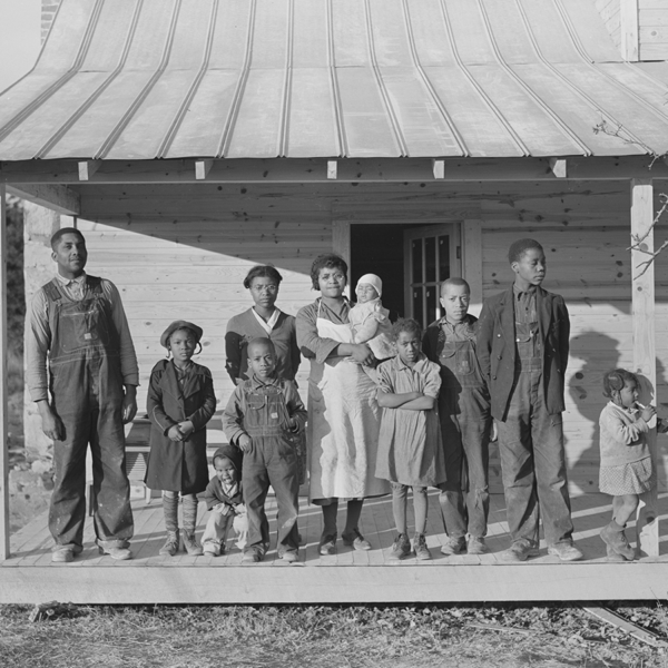“Negro family rehabilitation clients on porch of new home they are building near Raleigh, North Carolina”.1938. Courtesy of the Library of Congress.