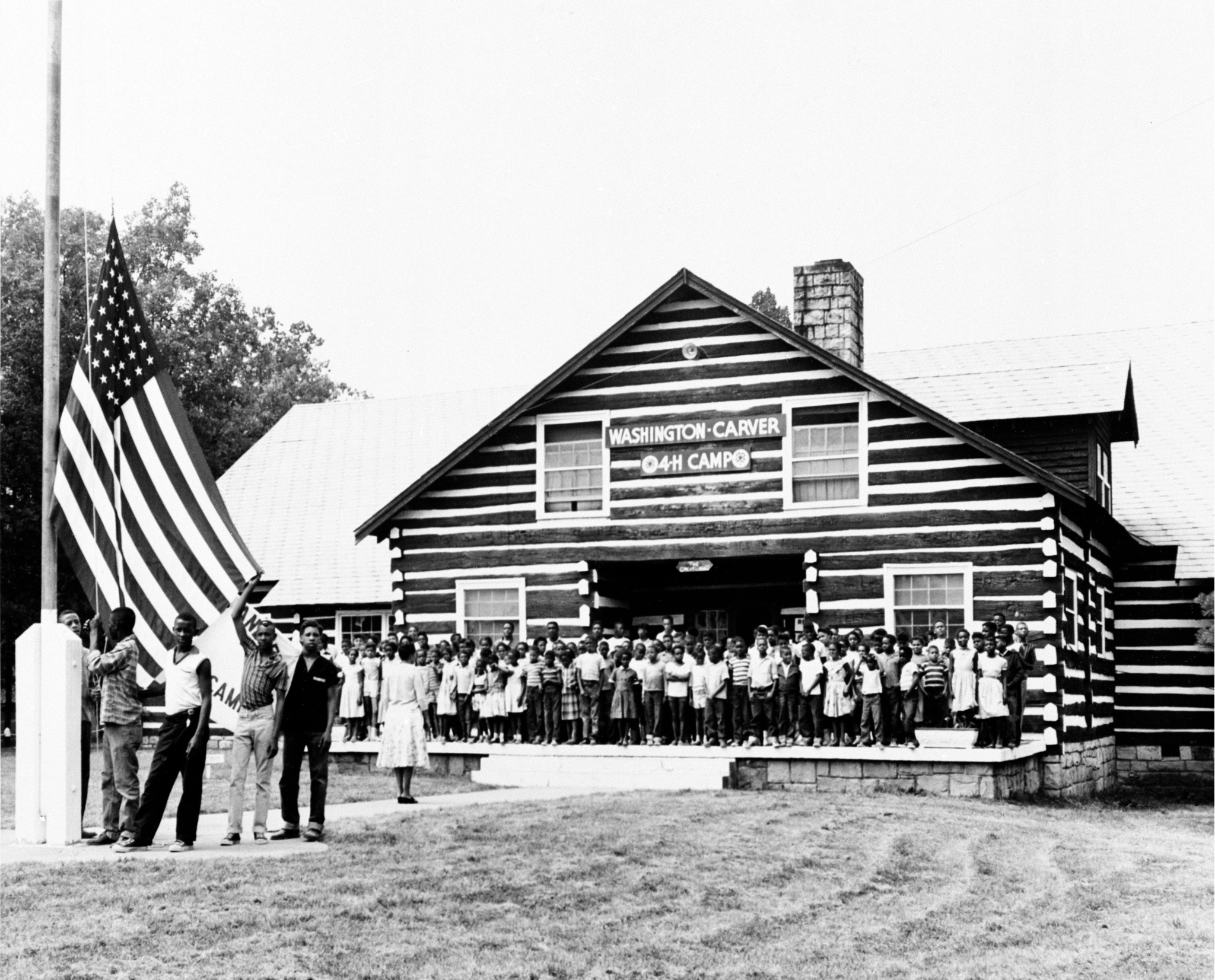 The Great Lodge at Camp Washington Carver, West Virginia, 1942. New River Gorge National Park and Preserve, West Virginia/National Park Service Collection The Great Lodge at Camp Washington Carver, West Virginia, 1942. New River Gorge National Park and Preserve, West Virginia/National Park Service Collection. Originally named “The West Virginia Negro 4-H Camp,” it opened in 1942 as the first 4-H camp for African Americans in the United States and eventually became known locally as “Clifttop.” It was renamed Camp Washington Carver in 1980. Work Progress Administration and Civilian Conservation Corps workers, along with prison laborers from nearby Moundsville did the early construction of the camp’s facilities, which eventually included the Great Lodge made of West Virginia chestnut logs, a few guest cabins, a water tank and pond, a small Health Center, and dormitories for campers. At its peak during the 1950s, the camp provided a safe environment for Black children to enjoy outdoor activities that were not normally available to them during the Jim Crow era. (See Swimming at Camp Washington Carver, West Virginia, 1942 photograph in the head slider for more information on the site.)