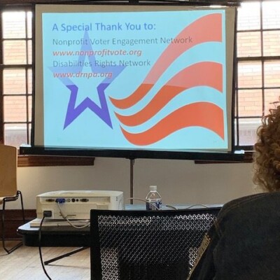 A presentation slide reads “A Special Thank You to: Nonprofit Voter Engagement Network www.nonprofitvote.org Disabilities Rights Network www.drnpa.org,” highlighting efforts to help African Americans vote, with a purple star and red stripes graphic. A presentation slide reads “A Special Thank You to: Nonprofit Voter Engagement Network www.nonprofitvote.org Disabilities Rights Network www.drnpa.org,” highlighting efforts to help African Americans vote, with a purple star and red stripes graphic.